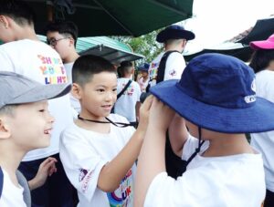 Checking the binoculars with great excitement.
